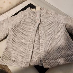 Baby Girl's FAO Schwarz grey cardigan sweater.